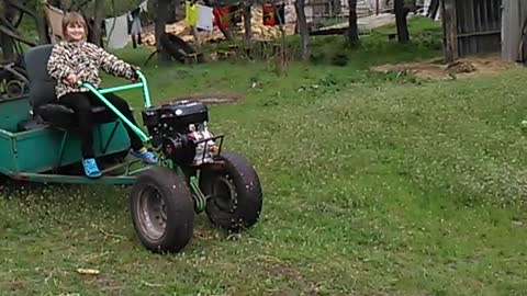 Daughter on a walk-behind tractor