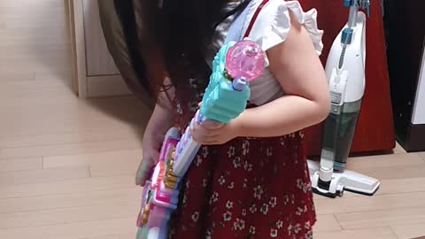 a toy-guitar-playing