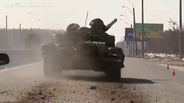 Russian tank convoy near Kyiv retreats under fire