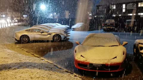 snowing on cars