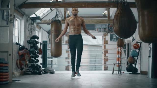 low level slow motion shot of a man skipping
