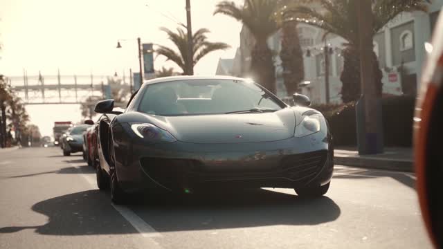 Luxury Sports Cars Passing on the Street