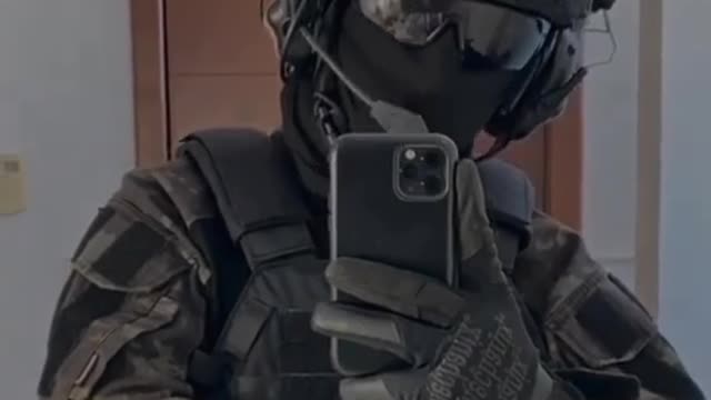 A handsome SWAT officer in full gear