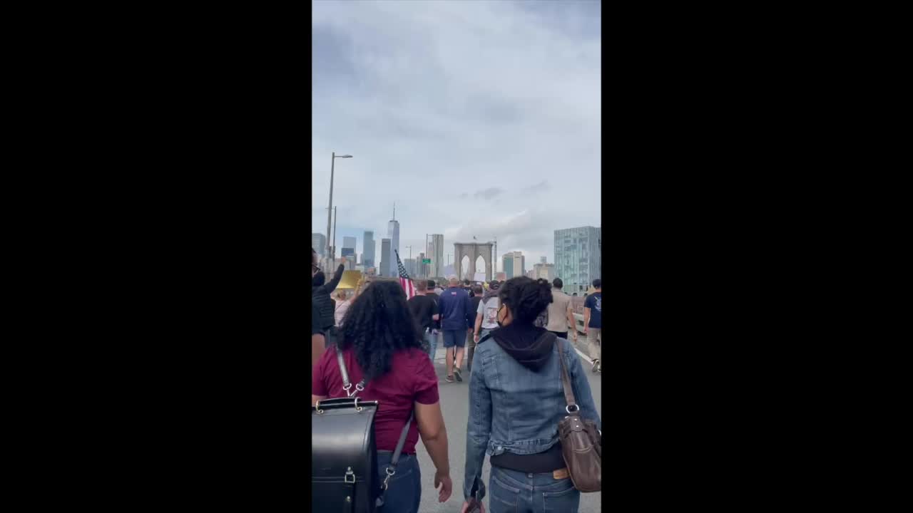 F Joe Biden by workers protesting vaccine mandate in Brooklyn