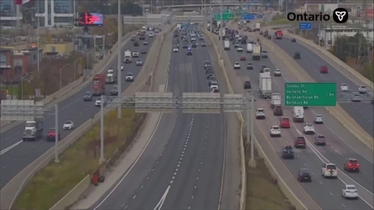 Taylor Swift gets a personal police escort into Toronto.