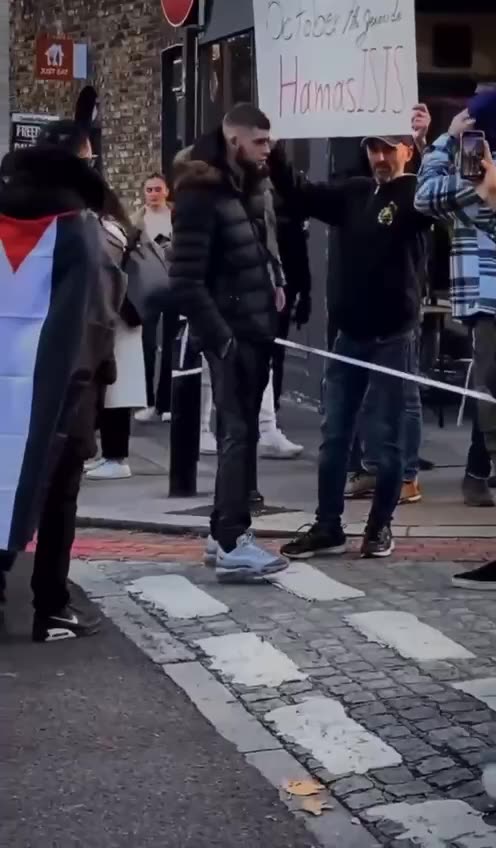 Pro Palestine Hamas sympathizers attack man holding sign