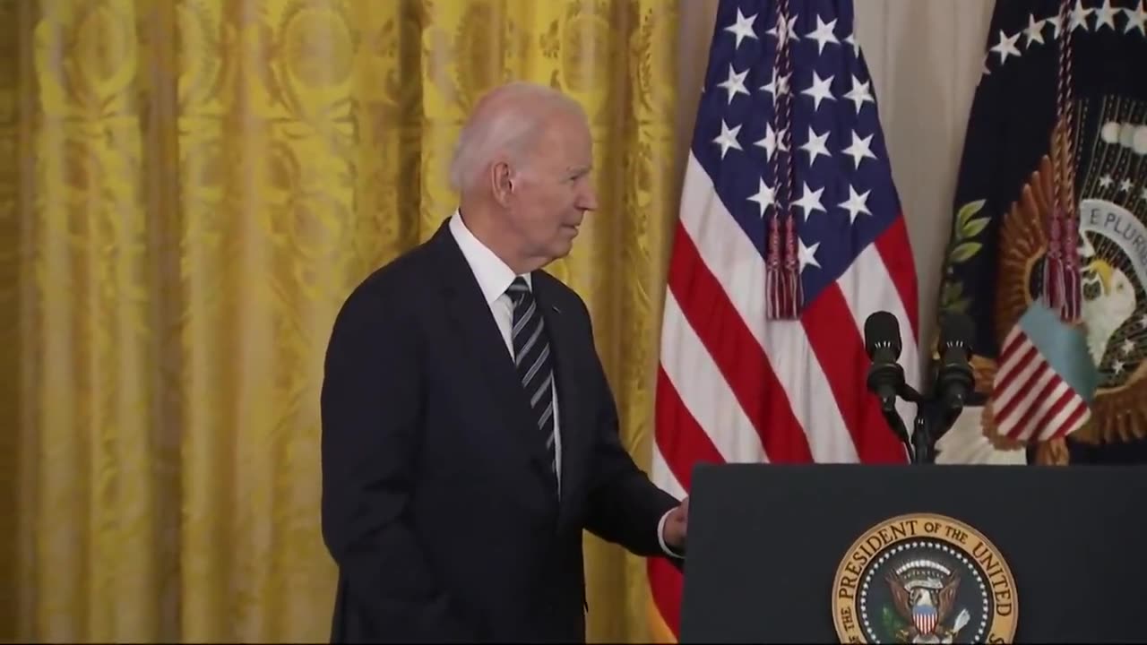 A confused Biden wraps up his remarks and immediately looks to his handlers for exit instructions