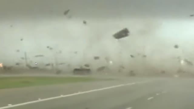 Tornado in Texas flips over a red cheve and drives off