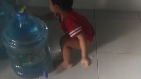 A baby "Pele" play foodball with bottle