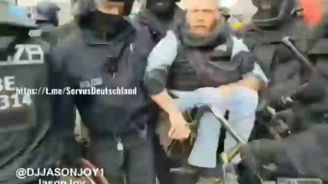 Gestapo in Germany Attack a Protestor in a Wheelchair