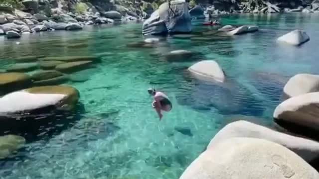 Jumping into the crystal clear water in Lake Tahoe 💎