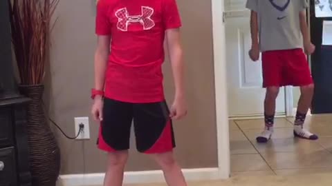 Kid Performs Dance Routine Unaware His Older Brother Is Stealing The Show