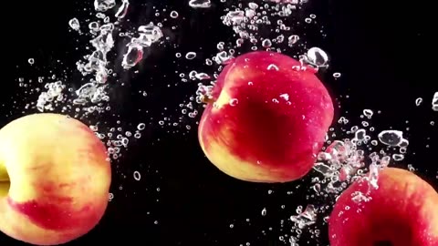 Apples falling through water