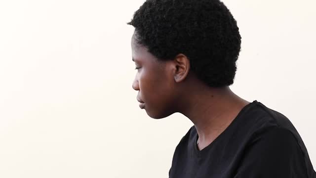 A Woman Looking up at a Sign on the Wall