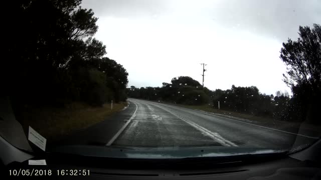 Van Slides Through Wet Intersection