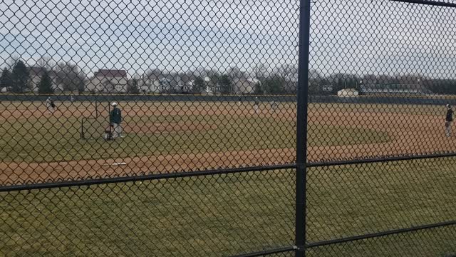 Logan hitting at baseball practice 2021