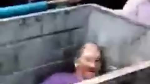 Menacing Mob of Angry Momma Bears Hand a Pedophile in a Trash Can Over to Police