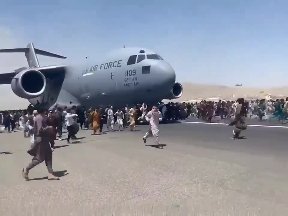 Afghans swarm aircraft