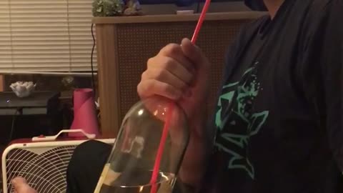 Guy puts fire under wine and then breathes out smoke