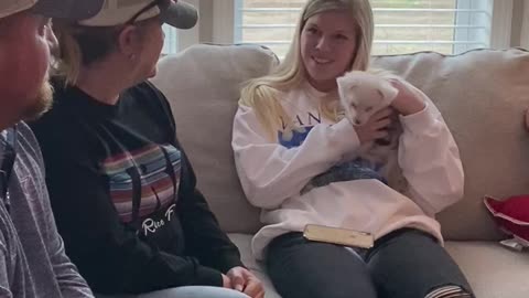 Emotional girl can't hold back tears for surprise puppy