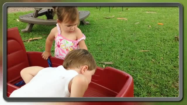 Cute babies meeting a frog for the first time