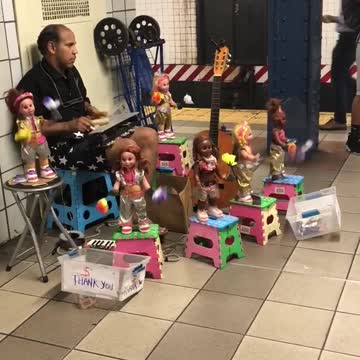 Man plays xylophone with toys around