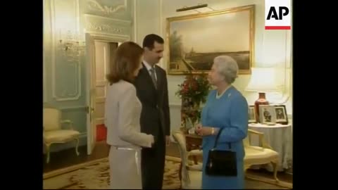 Prince Charles greets President Bashar Assad