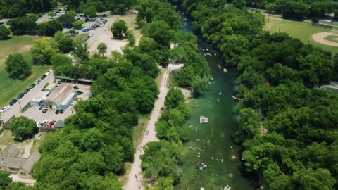 Aerial view of a river with people in and around it