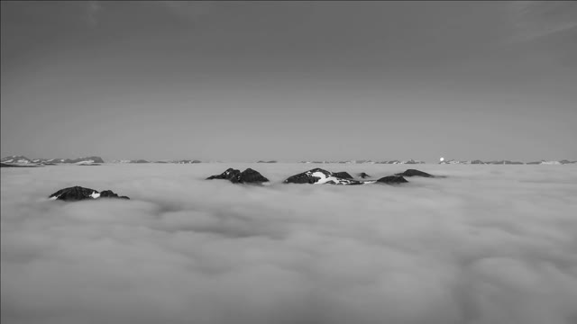 moonset over sunnmre alps mountain with inversion