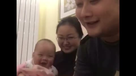 Father and his son laughing counting money