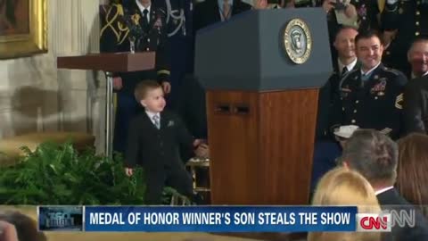 Little boy steals show at medal ceremony