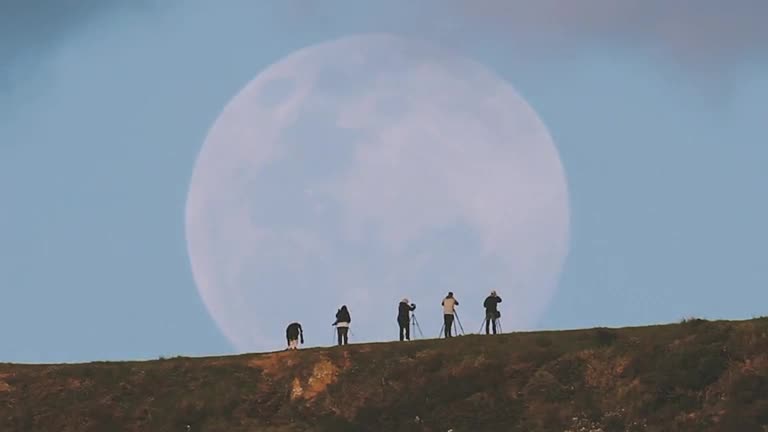 Photographers capture massive supermoon rising in New Zealand