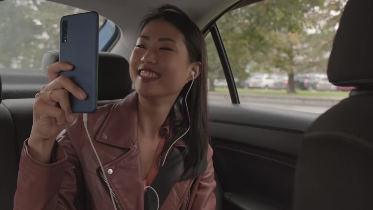 Woman Having A Video Chat While Inside A Car