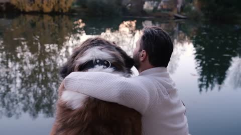 Friendship concept, man and dog sitting together