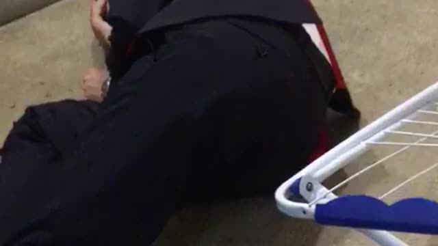 Guy falls while trying to sit down