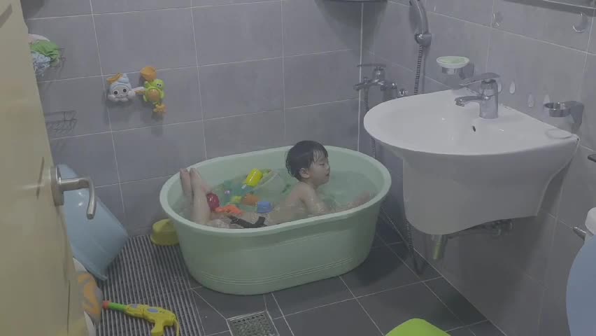 Baby freestyle swimming in the bathtub