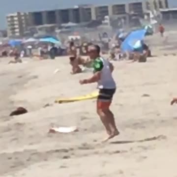 Full kookin man spins on beach