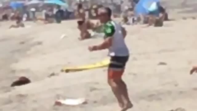 Full kookin man spins on beach