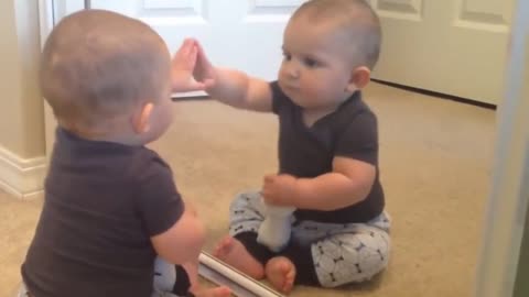 Baby Finds Himself In The Mirror.