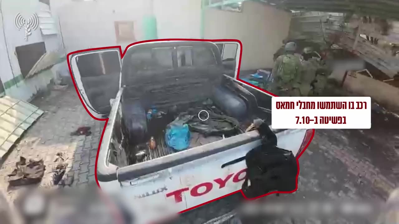 A white Toyota pickup truck containing weapons, similar to those used by Hamas