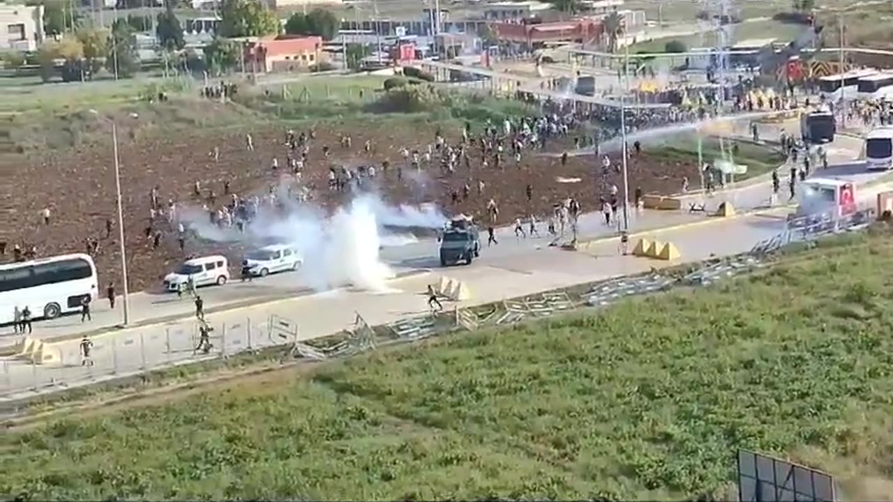 Turkish security forces disperse an angry crowd outside the U.S.