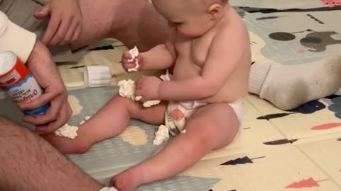 Family Enjoys A Spray Can Of Whipped Cream