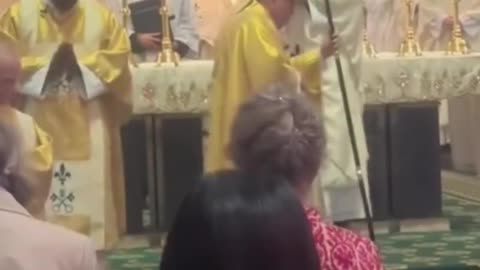 Newly ordained priests blesses Bishop.