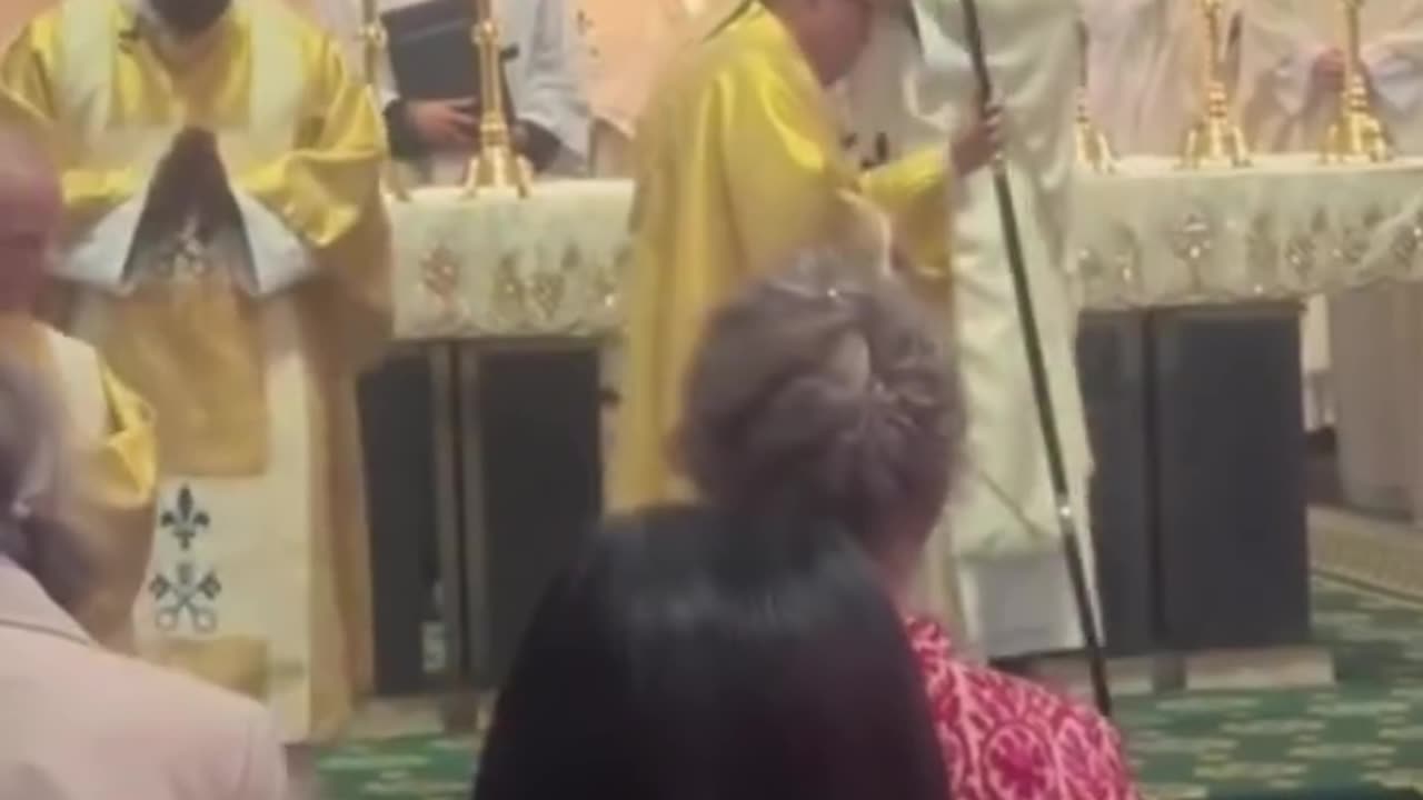 Newly ordained priests blesses Bishop.