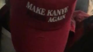 Make kanye black again red hat on subway