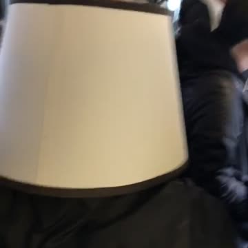 Person on subway with lamp on head