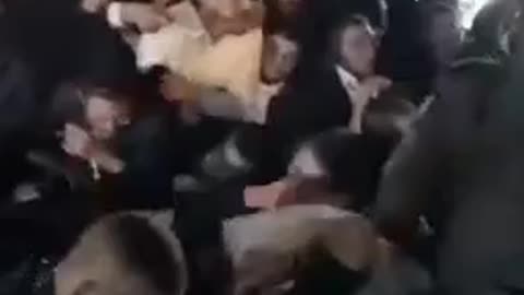 Terrorists in Meron standing over people dying