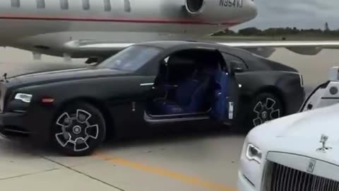 Private jet and Rolls-Royce dream car lifestyle and enjoyment