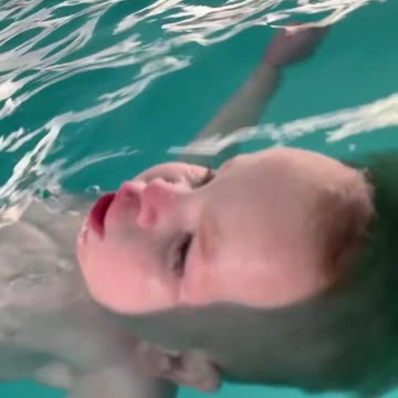 1-year-old jumps into pool, floats on his back