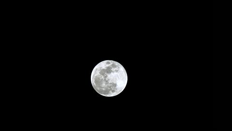 Silver moon in the dark sky
